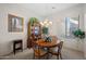 Traditional dining room with elegant chandelier, china cabinet, and round wood table at 3085 E Parkview Dr, Gilbert, AZ 85295