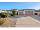 Charming single-story home features a spacious driveway, three-car garage, and desert landscaping at 3085 E Parkview Dr, Gilbert, AZ 85295