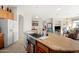 Open kitchen featuring an island with granite counters, stainless steel sink, and view into the living area at 3085 E Parkview Dr, Gilbert, AZ 85295