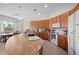 Bright kitchen with granite countertops, tile floors and white appliances at 3085 E Parkview Dr, Gilbert, AZ 85295