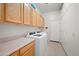 Well-equipped laundry room with modern appliances, ample cabinet space, and a convenient folding area at 3085 E Parkview Dr, Gilbert, AZ 85295