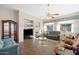 Spacious living room featuring a fireplace, built-in shelves, and plush seating at 3085 E Parkview Dr, Gilbert, AZ 85295
