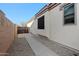 Side yard of home with private access and low-maintenance landscaping, offering practical outdoor space at 3085 E Parkview Dr, Gilbert, AZ 85295