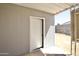 Backyard view from a door opening to a covered patio, with a view of the block wall at 319 S 90 Pl, Mesa, AZ 85208