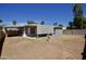 Overview of the home exterior, including the large backyard and covered patio at 319 S 90 Pl, Mesa, AZ 85208
