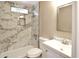 Bright bathroom with marble tile shower, modern vanity, and updated fixtures at 319 S 90 Pl, Mesa, AZ 85208