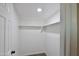 Walk-in closet with installed shelving for ample storage and organization at 319 S 90 Pl, Mesa, AZ 85208