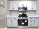 Bright kitchen featuring stainless steel appliances, new white cabinets and quartz countertops at 319 S 90 Pl, Mesa, AZ 85208