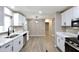 Bright kitchen with updated cabinets, quartz countertops and stainless steel appliances at 319 S 90 Pl, Mesa, AZ 85208
