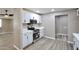 Well-equipped kitchen with stainless steel appliances and sleek white cabinets at 319 S 90 Pl, Mesa, AZ 85208