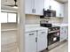 Kitchen featuring stainless steel appliances and new white cabinets at 319 S 90 Pl, Mesa, AZ 85208
