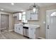 Bright kitchen with sleek white cabinets and modern stainless steel appliances at 319 S 90 Pl, Mesa, AZ 85208