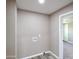 Bright laundry room features wood-look floors and convenient washer/dryer hookups at 319 S 90 Pl, Mesa, AZ 85208