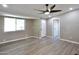Inviting living room featuring modern vinyl floors and a contemporary ceiling fan at 319 S 90 Pl, Mesa, AZ 85208