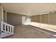 A covered patio with stairs leads to a door into the house, overlooking the backyard at 319 S 90 Pl, Mesa, AZ 85208