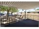 Relaxing covered patio with black metal railing, perfect for enjoying the outdoors at 319 S 90 Pl, Mesa, AZ 85208