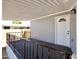 Inviting covered porch features sleek black railings, offering a cozy outdoor space at 319 S 90 Pl, Mesa, AZ 85208