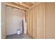An unfinished storage room with a concrete floor and wood frame construction at 319 S 90 Pl, Mesa, AZ 85208