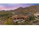 Expansive aerial view of the desert home featuring a private pool, patio, and mountain views at 3553 N Crystal Peak Cir, Mesa, AZ 85207