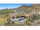 Aerial view of a desert home showcasing a private pool and extensive outdoor living space at 3553 N Crystal Peak Cir, Mesa, AZ 85207