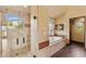 Bathroom with large walk-in shower, soaking tub, and beautiful views at 3553 N Crystal Peak Cir, Mesa, AZ 85207