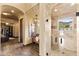 Elegant bathroom featuring a glass walk-in shower with natural light and a decorative bench with stylish light fixture at 3553 N Crystal Peak Cir, Mesa, AZ 85207
