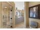 Beautiful bathroom with double vanities, a framed mirror, and a separate tiled shower area at 3553 N Crystal Peak Cir, Mesa, AZ 85207