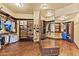Spacious walk-in closet with custom shelving, wooden floors, and a full length mirror at 3553 N Crystal Peak Cir, Mesa, AZ 85207