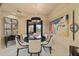 Stylish dining room with modern lighting, elegant furnishings, and outdoor views at 3553 N Crystal Peak Cir, Mesa, AZ 85207
