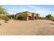 Three-car garage with brick driveway and desert landscaping at 3553 N Crystal Peak Cir, Mesa, AZ 85207