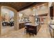 Open kitchen featuring granite counters and island that connects with the living room at 3553 N Crystal Peak Cir, Mesa, AZ 85207