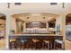 Entertainers kitchen with ample seating, stone countertops, seamless access to the adjacent kitchen at 3553 N Crystal Peak Cir, Mesa, AZ 85207
