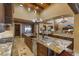 Elegant kitchen with an oversized island, stone countertops, premium appliances, and seamless access to a walk-in pantry at 3553 N Crystal Peak Cir, Mesa, AZ 85207