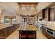 Spacious kitchen featuring granite counters, stainless appliances and large island with seating at 3553 N Crystal Peak Cir, Mesa, AZ 85207