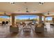 Inviting outdoor patio with comfortable seating overlooking a sparkling pool and desert landscape at 3553 N Crystal Peak Cir, Mesa, AZ 85207