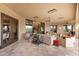 Spacious covered patio with comfortable sofas and chairs, offering seamless indoor-outdoor living and entertainment space at 3553 N Crystal Peak Cir, Mesa, AZ 85207