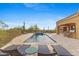 Beautiful backyard pool with desert landscaping and comfortable lounge chairs for relaxing poolside at 3553 N Crystal Peak Cir, Mesa, AZ 85207