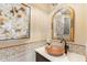 Chic powder room featuring decorative tiles, a bronze sink, and an ornate mirror at 3553 N Crystal Peak Cir, Mesa, AZ 85207