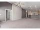 Spacious living room featuring neutral carpet, high ceilings and an open floor plan at 3834 W Commonwealth Ave, Chandler, AZ 85226