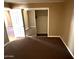 Bedroom featuring carpet and ample closet space at 4065 E University Dr # 4, Mesa, AZ 85205