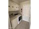 Laundry area with washer, dryer, and storage cabinets at 4065 E University Dr # 4, Mesa, AZ 85205