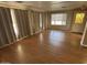 Spacious living room with hardwood flooring and large windows at 4065 E University Dr # 4, Mesa, AZ 85205