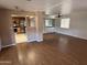 Bright, open living room featuring hardwood floors and a clear view into the kitchen at 4065 E University Dr # 4, Mesa, AZ 85205