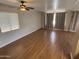 Bright living room with a ceiling fan and large windows with blinds at 4065 E University Dr # 4, Mesa, AZ 85205