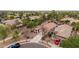 Suburban home with a well-maintained yard, tile roof, desert landscaping, and a long driveway at 4152 S Bandit Ct, Gilbert, AZ 85297