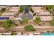 Aerial view of a suburban cul-de-sac with homes featuring tile roofs, desert landscaping, and well-maintained yards at 4152 S Bandit Ct, Gilbert, AZ 85297