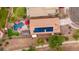 Aerial view of the home showing the backyard pool and solar panels on the roof at 4152 S Bandit Ct, Gilbert, AZ 85297