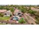 Aerial view of the home showing the backyard pool and putting green in a residential neighborhood at 4152 S Bandit Ct, Gilbert, AZ 85297