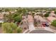 Suburban home with a well-maintained yard, solar panels, tile roof, desert landscaping, and a circular driveway at 4152 S Bandit Ct, Gilbert, AZ 85297