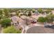 Suburban home with a well-maintained yard, solar panels, tile roof, and desert landscaping in a circular driveway at 4152 S Bandit Ct, Gilbert, AZ 85297